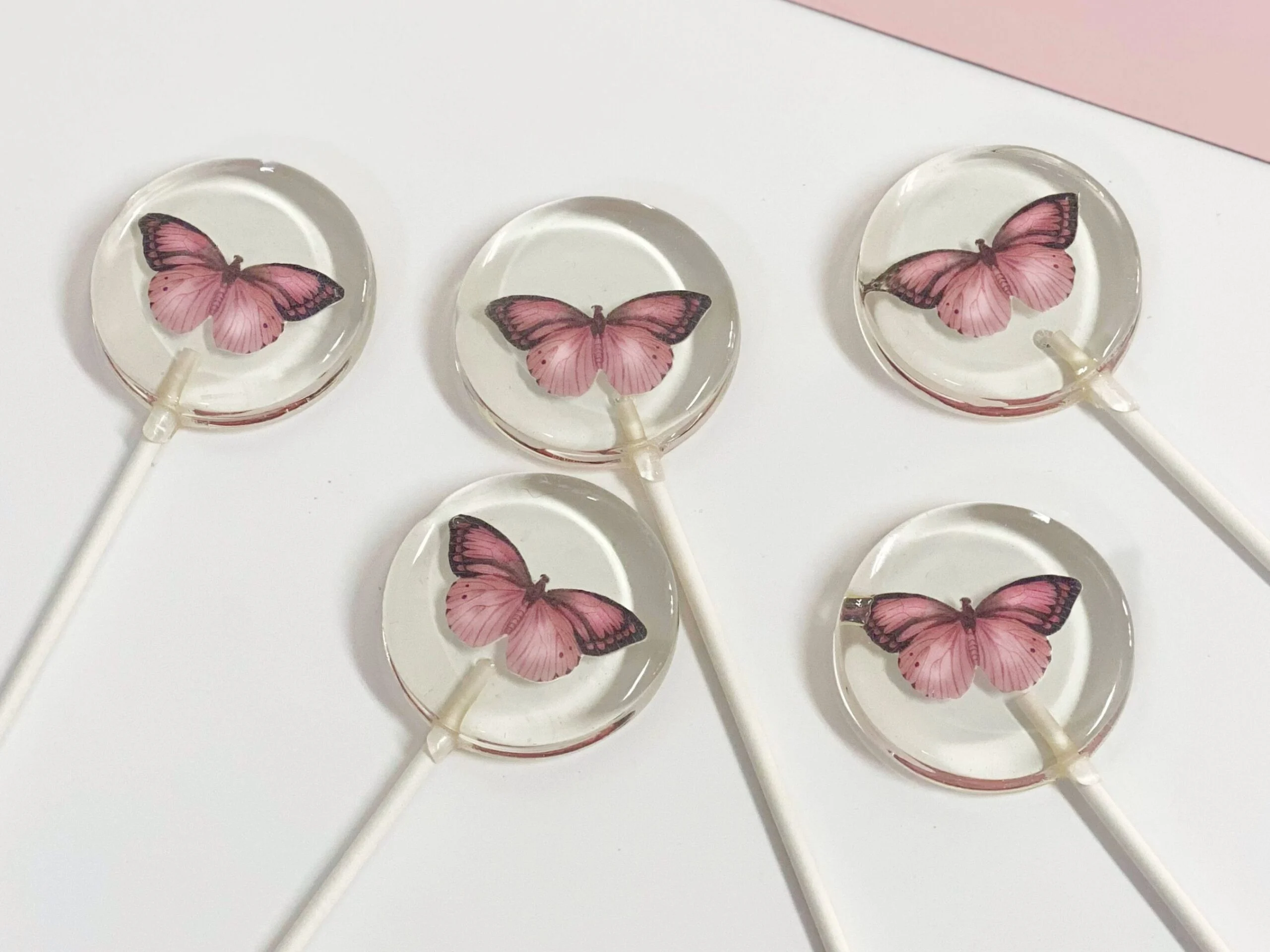 Sucettes papillon roses personnalisées