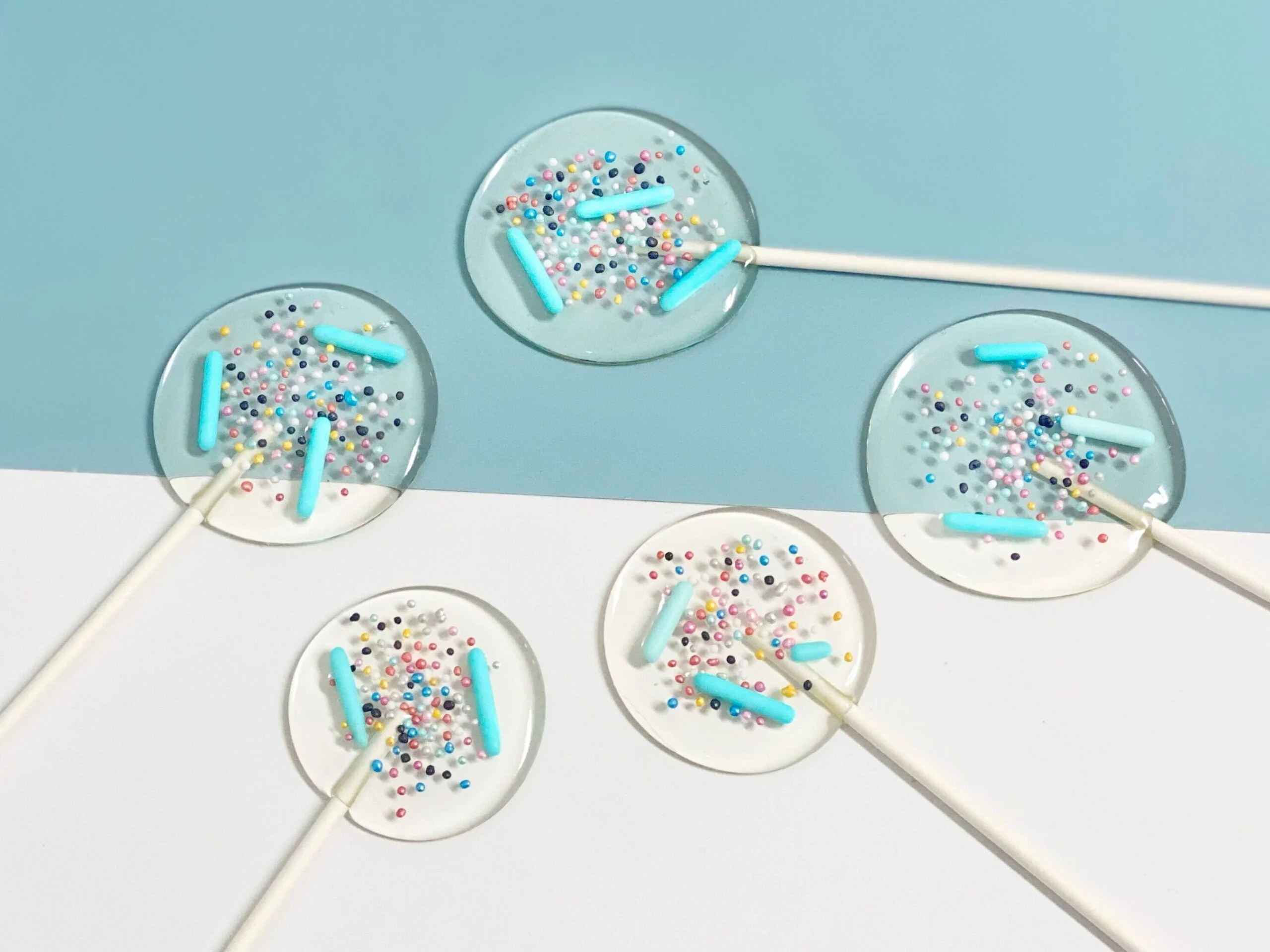 Personalized lollipops with blue sprinkles