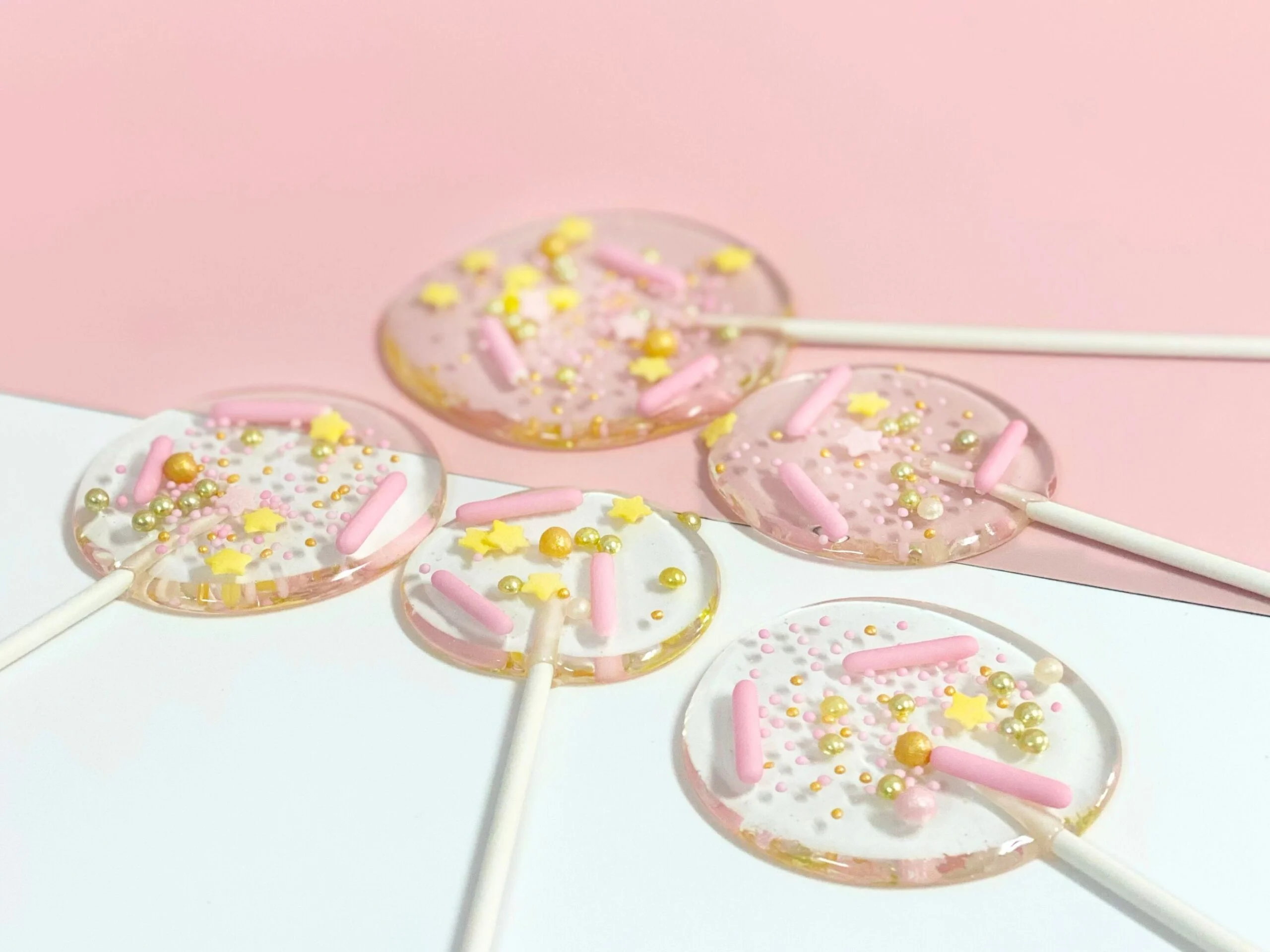 Custom lollipops with pink sprinkles